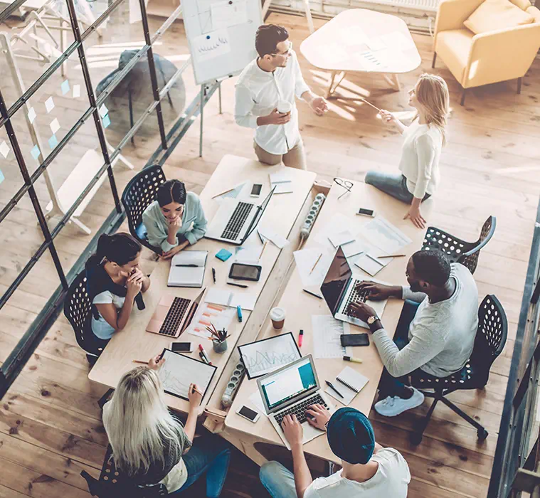 A team of people strategizing in a meeting room.