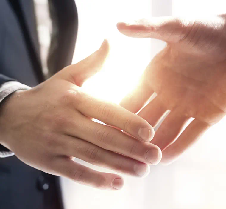 Two business men shaking hands.