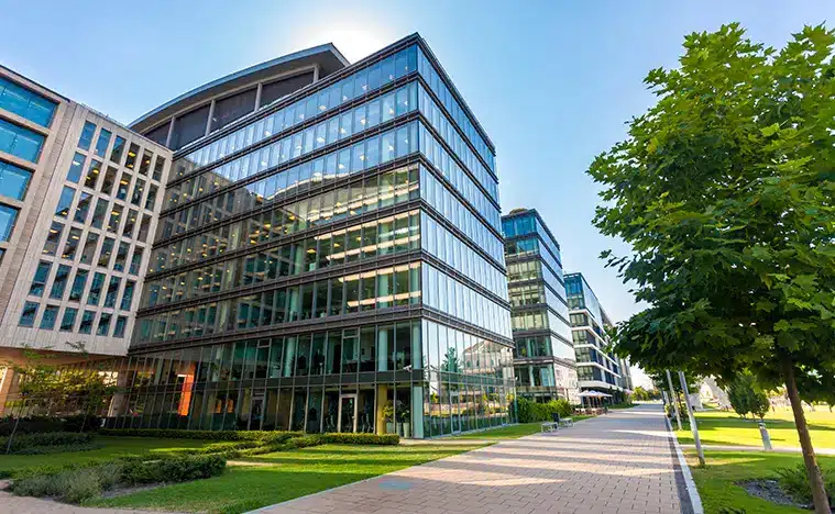 Services Selling Properties Modern office building in a green area.